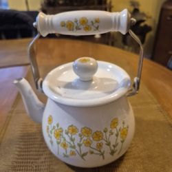 Enamel where teapot with floral design