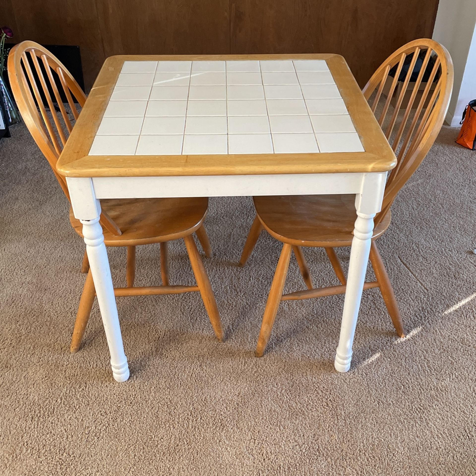 Tile Table With two Wooden Chairs