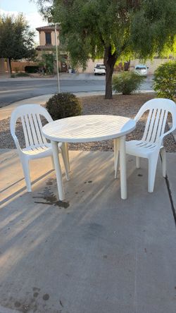 Plastic table with chair chairs