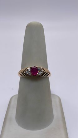 12k gold ring with red CZ