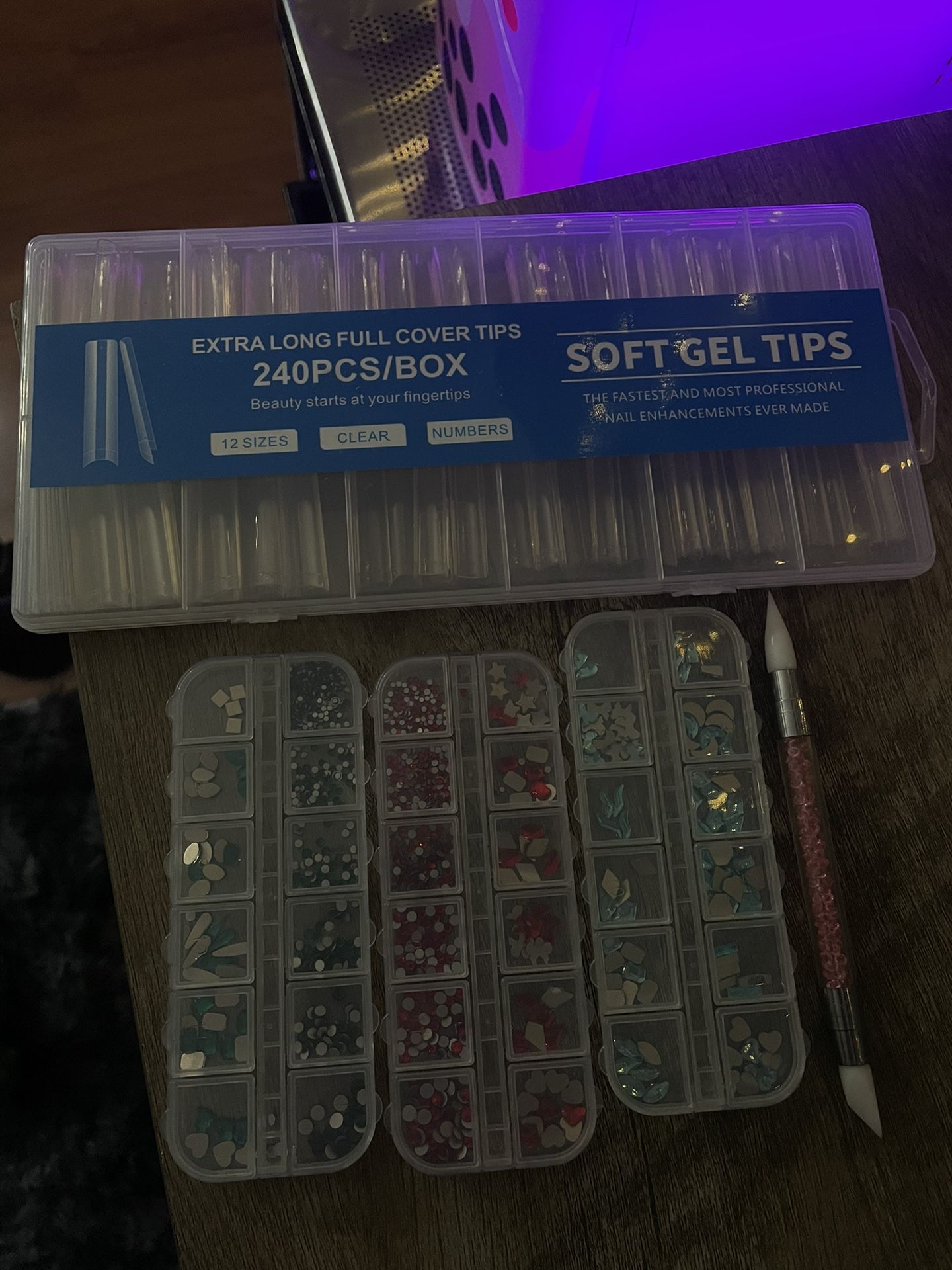 Nail tips and rhinestone gems