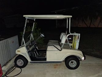 2 club car golf carts.