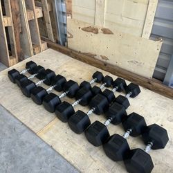 New pair of 20,25,30,45,50,55 and 60lb rubber dumbbells NEW IN BOX $570