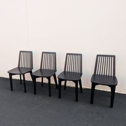 Set of 4 black wooden dining chairs