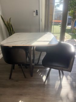 Marble game table plus four leather chairs
