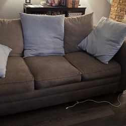 Grey Couch And Lovesest With Pillows