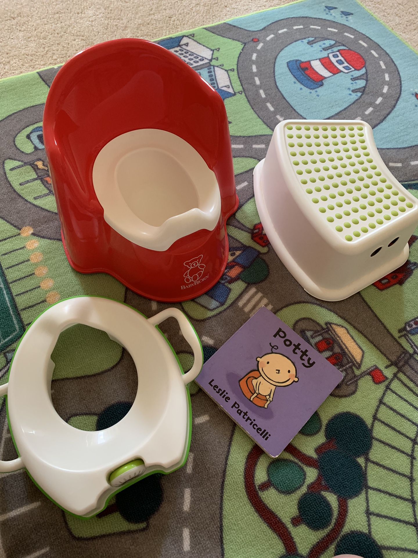 Potty set: a ikea step, a potty, a portable cover seat and kid book