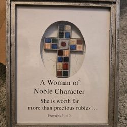 A mosaic-style cross and a biblical quote 