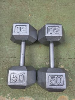 Pair of 50 lbs Iron dumbells