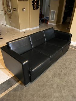 Selling a black leather sofa for just $85! 🛋️