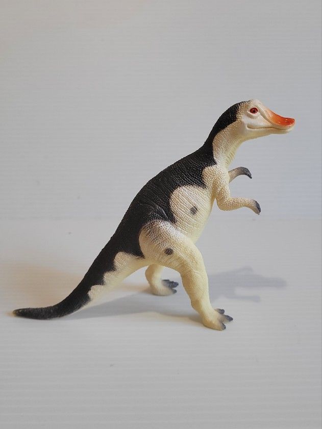 Dinosaur action figure with the words Hanrosaurus Made in China under 5" Tall. 

