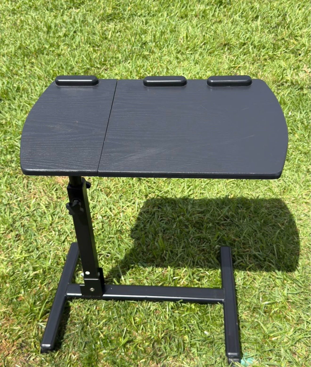 Selling height-adjustable laptop desk.