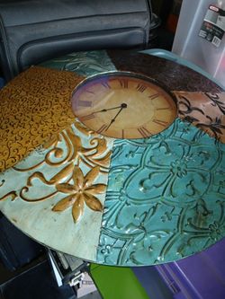 Metal wall. Clock