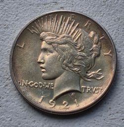 MS 1921 Peace Dollar. Nice toning. Great strike.
May be MS61-62