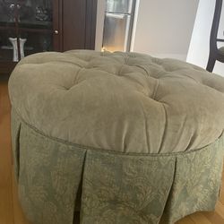 Rolling Ottoman With Tufted Cushion Top And Tapestry Trim Bottom 
