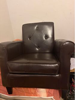 Brown small single seat couch