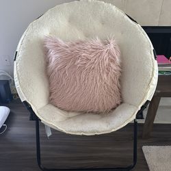 Fluffy chair with pink cushion 