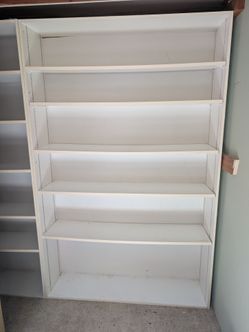 Two solid white bookcases
