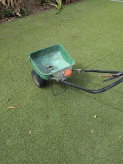Fertilizer and grass seed spreader