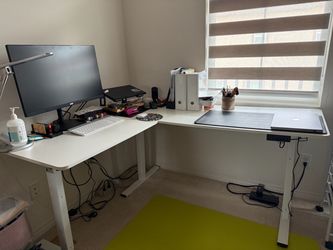 L-shaped standing desk with charging station