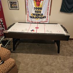 standard air hockey table, by Brunswick Billiards. 