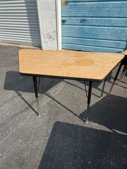 Half round tables, school desks, stools, children’s chairs All must go