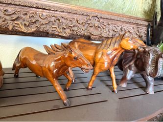 Teak horse statue
