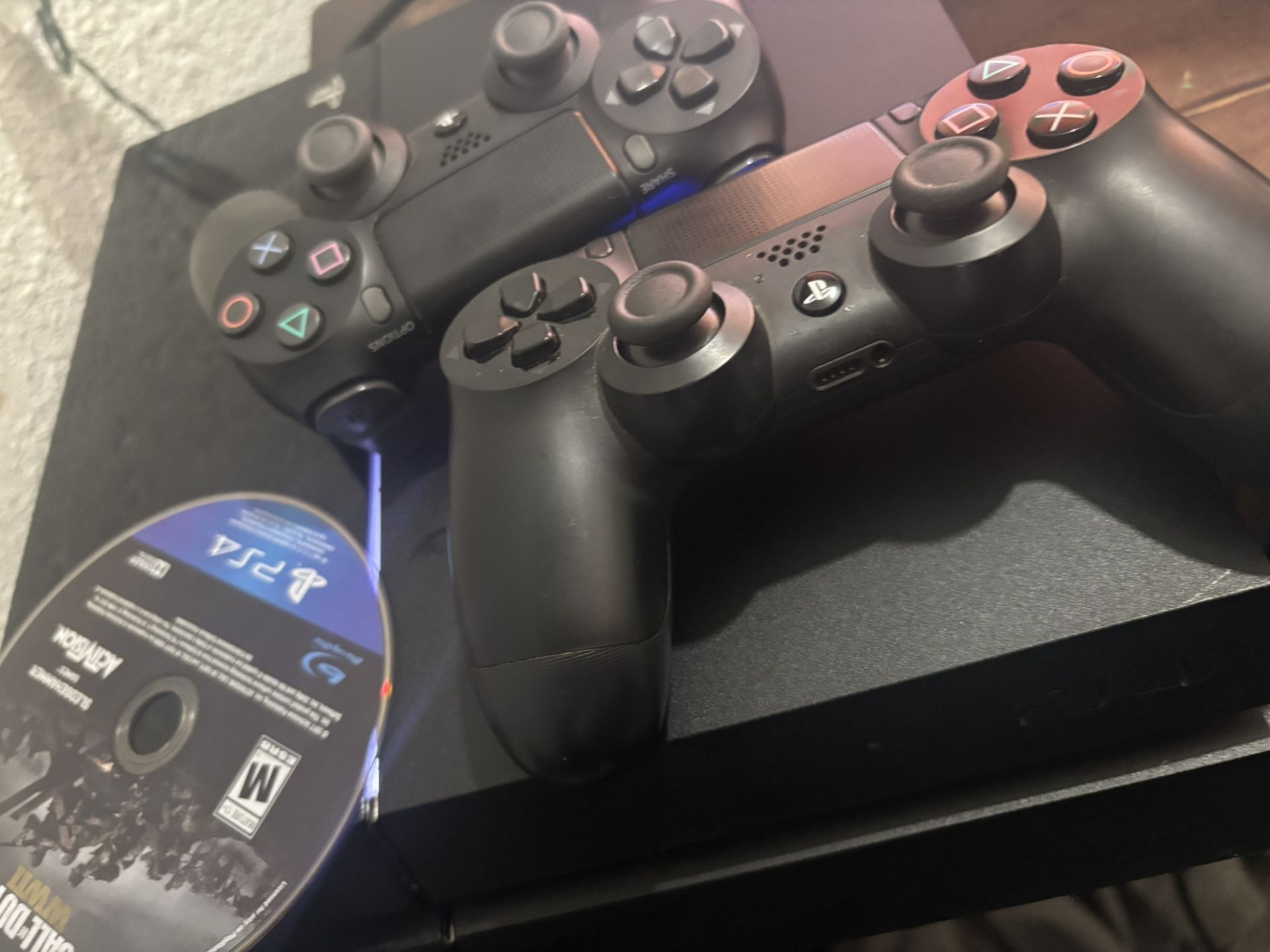 PS4 With Two Controllers And WW2
