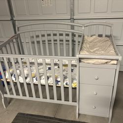 Gray Mini Crib And Storage 