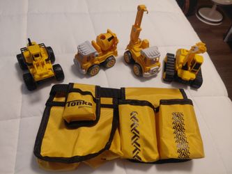 Toy trucks 4 trucks total with tool belt included