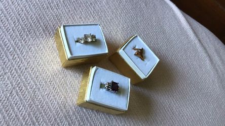 3 Cocktail rings.  silver and purple, gold and cubic zirconia and third dolphin gold with one cubic zirconia. Super shiny in person