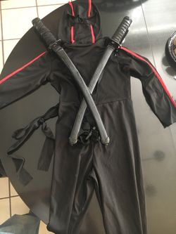 Ninja halloween costume with cross swords