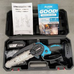 Mini Chainsaw. 6" Brushless. 
Built-In Oiling.  
Two (2) 21-Volt Batteries.
