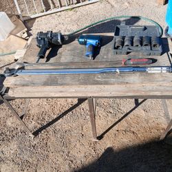 2 Impact Guns A Set Of Sockets A Torque Rench And A Pribar 