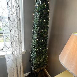 Two fake trees with lights