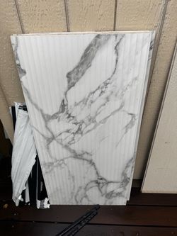 white marble-porcelain tile with a fluted finish