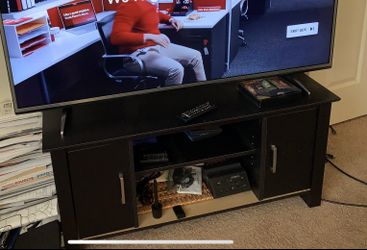 TV STAND EASILY HOLDS THIS 55” TV