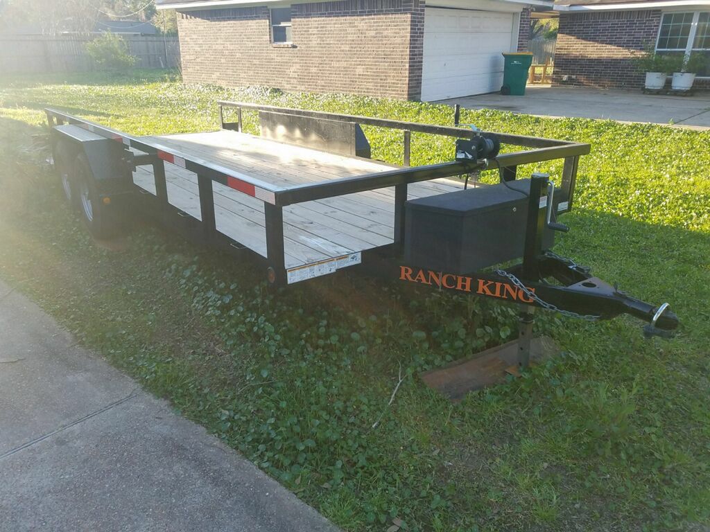 18ft Ranch King Heavy Duty trailer, can hold 6400 lbs, clean title, ramps included , hitch lock and tool box plus winch! Electric breaks.