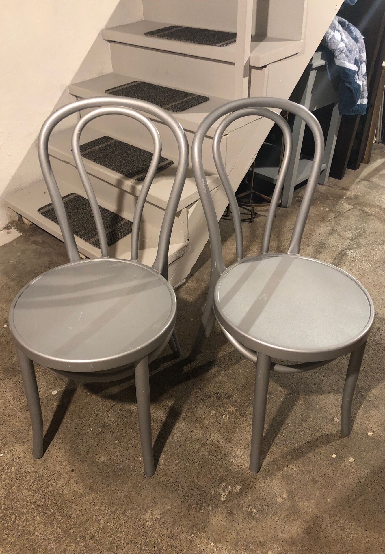 Pair of silver plastic dining chairs