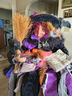 Sitting Witch with broom and cat