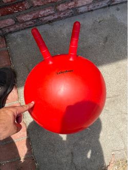 Kids bounce on ball
