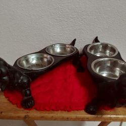 2 CAST IRON DASCHUND FEEDING BOWLS
