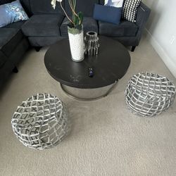 Round coffee table with 2 metal accent stools. Selling as a set.