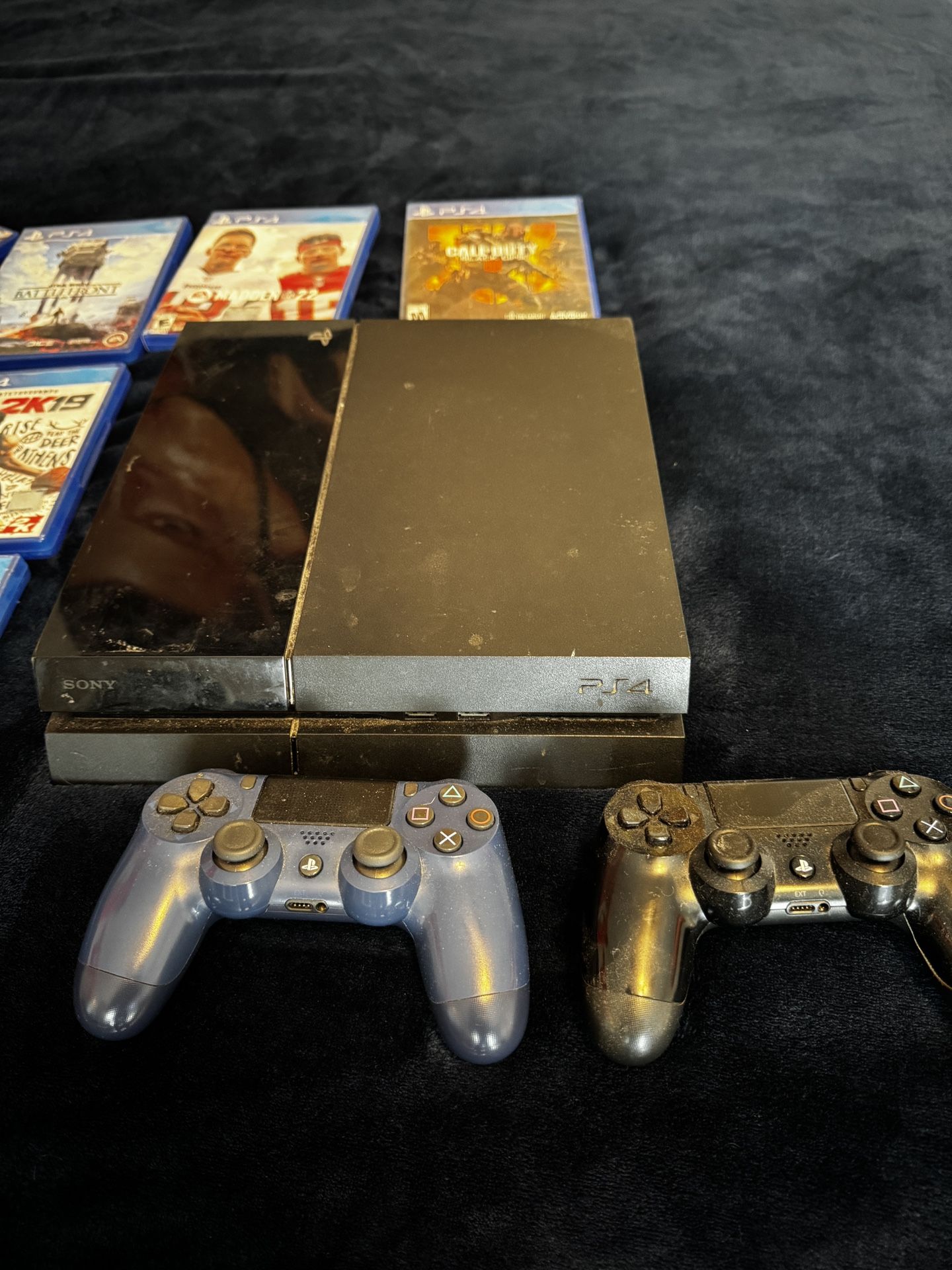 PS4 with games and controllers
