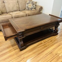 A Big Coffee Table With Drawers