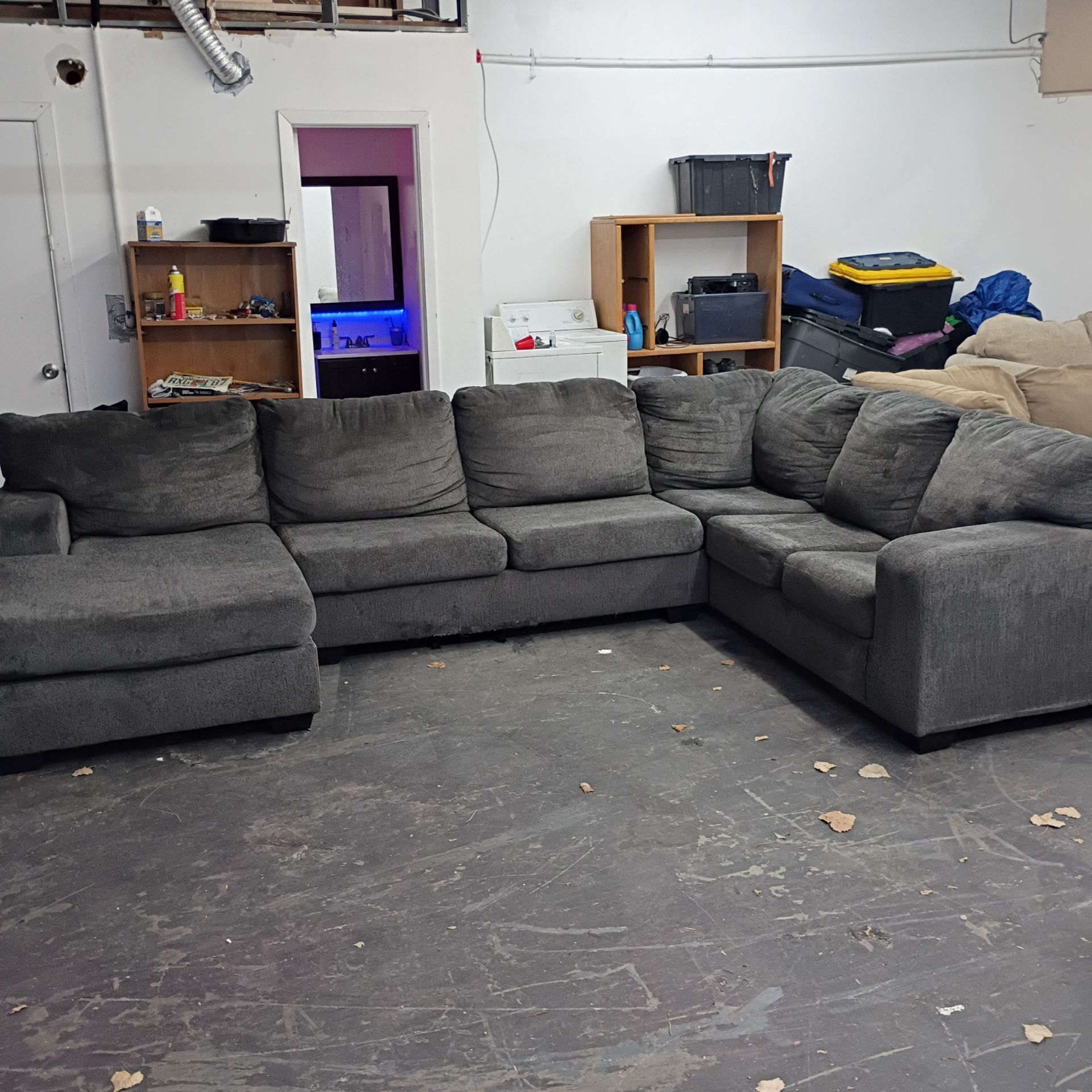 Large dark gray sectional couch with Chase