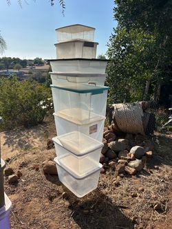 8 various sized clear bins with lids
