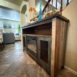 Beautiful rustic fireplace /tv stand in excellent condion with two mesh doors multicolor finish