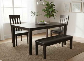 Solid dark wood dining table, used like new, no issues