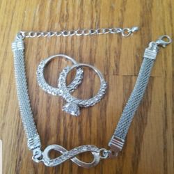 Sterling Silver Cubic Zirconia diamonds rings and a Sterling Silver Endless Love infinity Bracelet
  
Please go to my page and see other items that I 